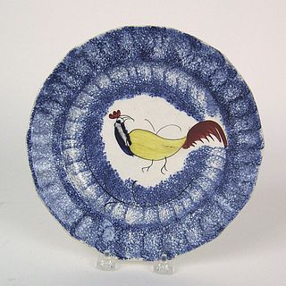 Blue spatter plate with blue, yellow, and red roos