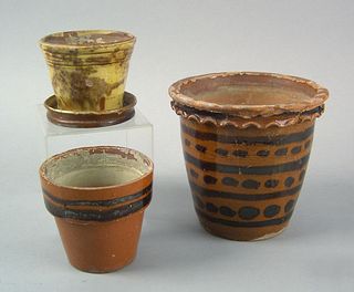 Three Pennsylvania redware flowerpots, early 19th.