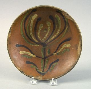 Pennsylvania redware pie plate, 19th c., with larg