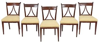 A Set of Eight Classical Carved and Upholstered Dining Chairs