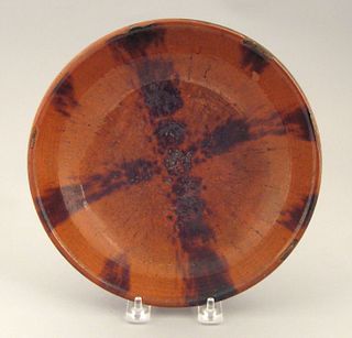 Redware shallow bowl, 19th c., with manganese cros