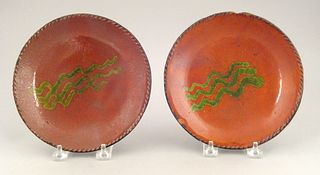 Two Pennsylvania redware pie plates, 19th c., with