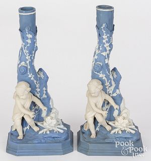Two Wedgwood figural cherub candlesticks