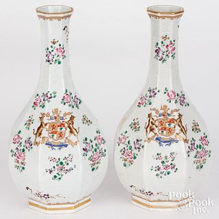 Pair of enameled porcelain bottles with crest