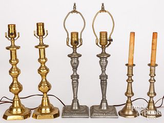 Three pairs of candlesticks mounted as table lamps