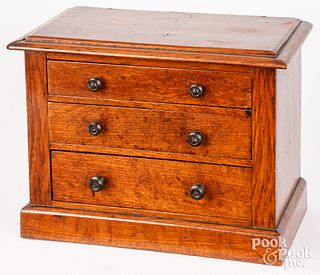 Miniature walnut chest of drawers, 19th c.