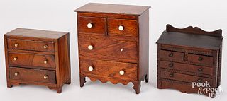 Three miniature doll size chest of drawers, 19th c