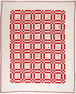 Red and white embroidered quilt