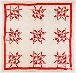 Red and white star patchwork quilt