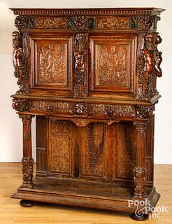 Continental carved oak two-part cupboard, 19th c.