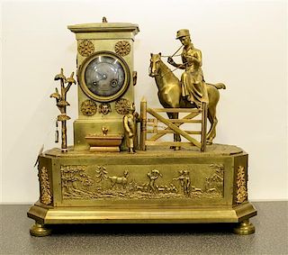 A French Gilt Metal Figural Clock. Height overall 14 1/2 inches.