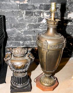 * A Pair of Neoclassical Cast Metal Urns Height of taller urn 22 1/4 inches.