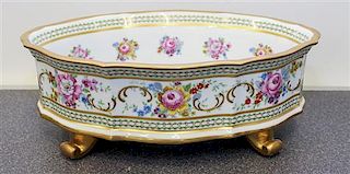 * A Limoges Polychrome and Gilt Decorated Porcelain Center Bowl Width 13 1/8 inches.