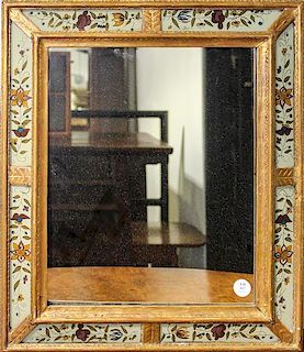 * A Giltwood and Eglomise Decorated Mirror Height 21 1/4 x width 18 1/2 inches.