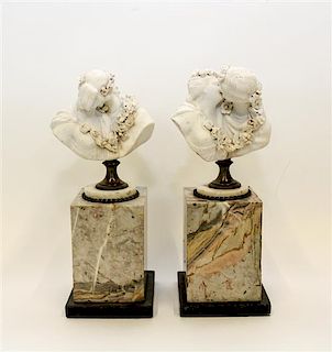 A Pair of French Bisque Porcelain Busts Height 8 3/4 inches.