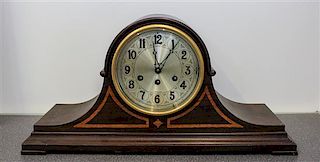 An English Mahogany Shelf Clock. Height 10 1/2 inches.
