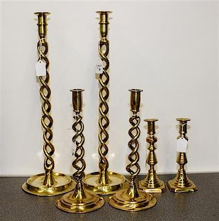 Three Pairs of English Brass Candlesticks Height of tallest pair 19 1/2 inches.