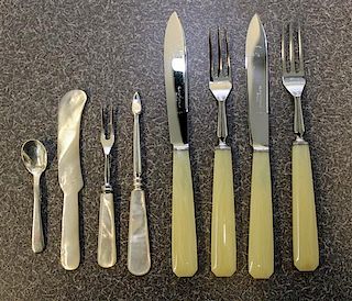 * A Collection of Bakelite and Mother-of-Pearl Handled Flatware Length of first 8 inches.