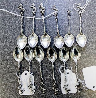 A Set of Twelve Continental Silver Coffee Spoons, , each having a finial decorated with a rearing horse atop a twist stem.