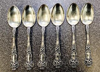 A Set of Six Silver Teaspoons, likely Canadian, the handles decorated with floral and C-scroll motifs