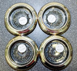 A Set of Four American Silver and Glass Coasters Diameter 4 1/8 inches.