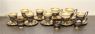 * A Set of Nine American Silver Demitasse Cups Height of first 2 1//4 inches.