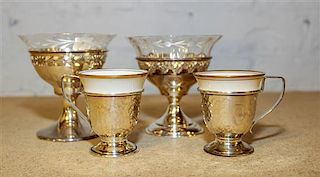 A Set of Twelve Silver Dessert Cups, International Silver Co., in two patterns, eleven having glass liners, together with six