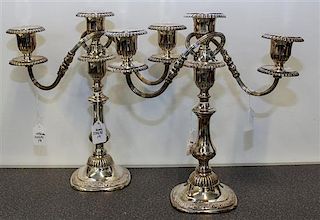 * A Pair of Three-Light Silver-Plate Candelabra Height of each 13 1/4 inches.