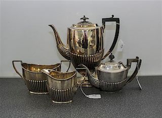 * An English Silver Teapot, Joseph Rogers Width of first over handle 9 inches.