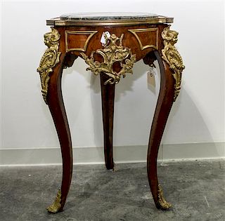 * A Louis XV Style Gilt Bronze Mounted Burl Walnut Occasional Table. Height 32 1/2 inches.