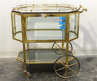 A French Brass Bar Cart. Height 32 1/2 x width 20 x length 33 1/2 inches.