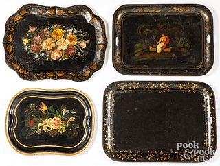 Four large painted tin trays