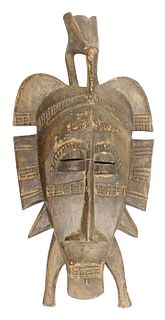 Carved Wooden African Mask with Bird Atop