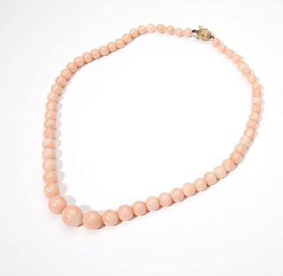 A strand of graduated coral beads