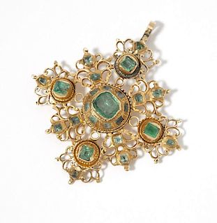 An antique emerald and gold pendant