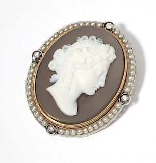 A stone, seed pearl and platinum cameo brooch