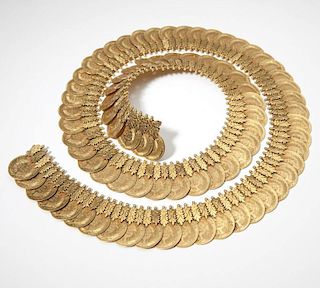 An elaborate high karat gold and coin necklace