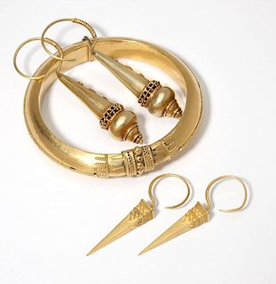 A gold bangle and two pair of earrings