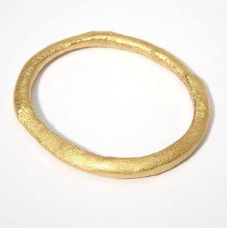 A high-karat gold bangle