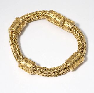 A high-karat gold woven bracelet