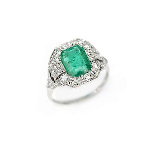An Art Deco emerald, diamond and platinum ring
