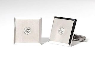 A pair of diamond and white gold cufflinks