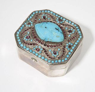 A silver and gemset box