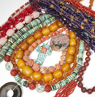 A large collection of beads and bakelite jewelry