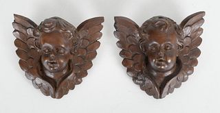 Pair of Baroque Style Carved Walnut Putti