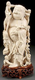 A CHINESE CARVED IVORY BUDDHA, LATE 19TH/EARLY 20