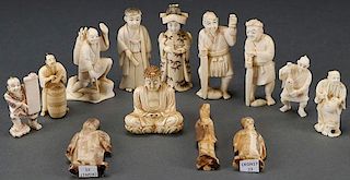 A GROUP OF 13 JAPANESE CARVED IVORY OKIMONOS, CIR