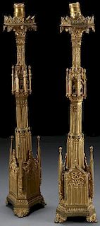 A PAIR OF GILT BRONZE GOTHIC STYLE CANDLE STANDS