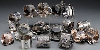 A GROUP OF 16 SILVER PLATE FIGURAL NAPKIN RINGS