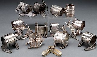 A GROUP OF 14 SILVER PLATE NAPKIN RINGS
